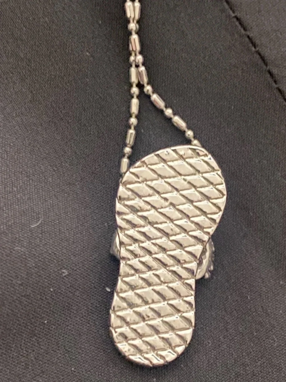 Coach pendant flip